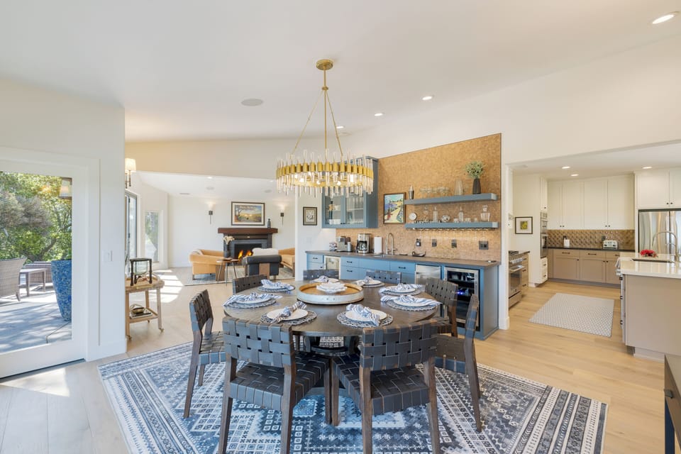 The stunning chandelier centers on a table with seating for 8.