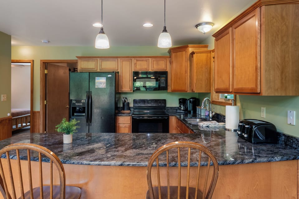Granite countertops and barstool seating.