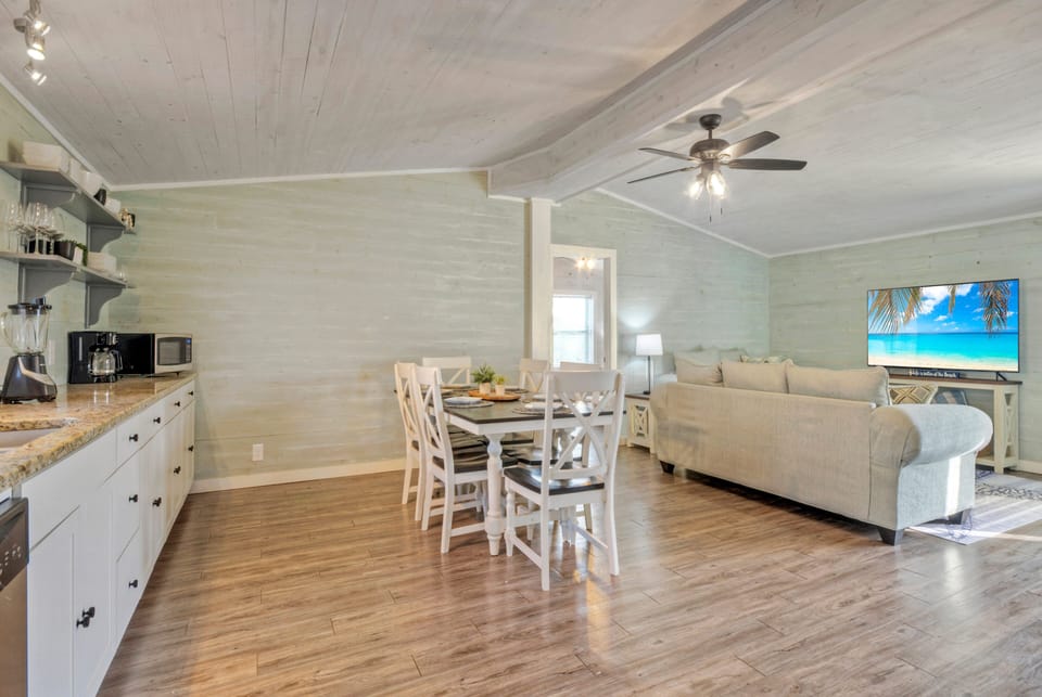 The dining area is seamlessly connected to the kitchen.