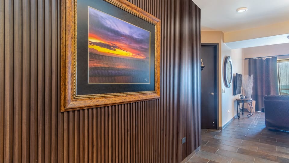 Stylish wood paneled wall as you enter the unit
