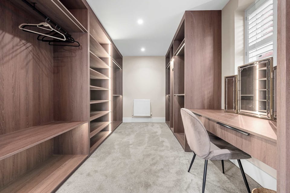 Sleek vanity and oversized mirror in your private bathroom with premium toiletries provided