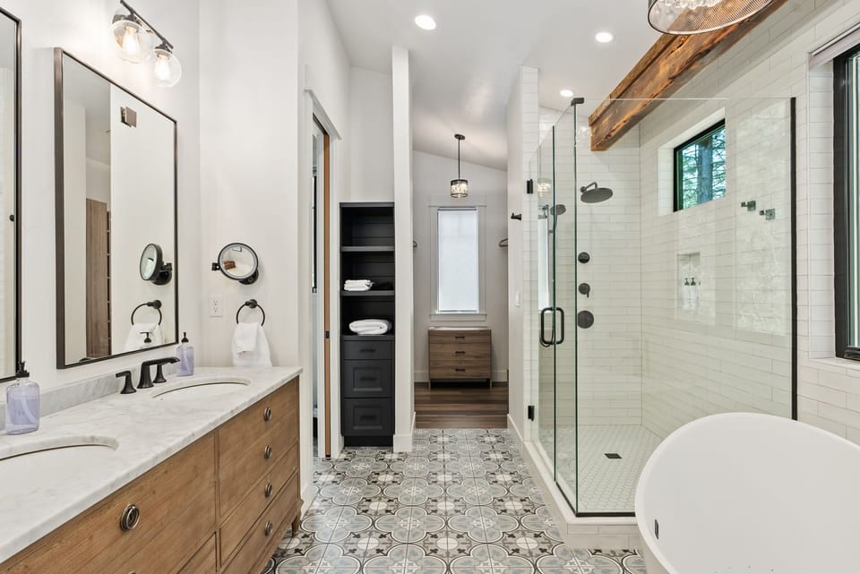 En-Suite Master Bathroom, double sinks and a large freestanding jetted tub + Frameless Glass for Spa-Like Style