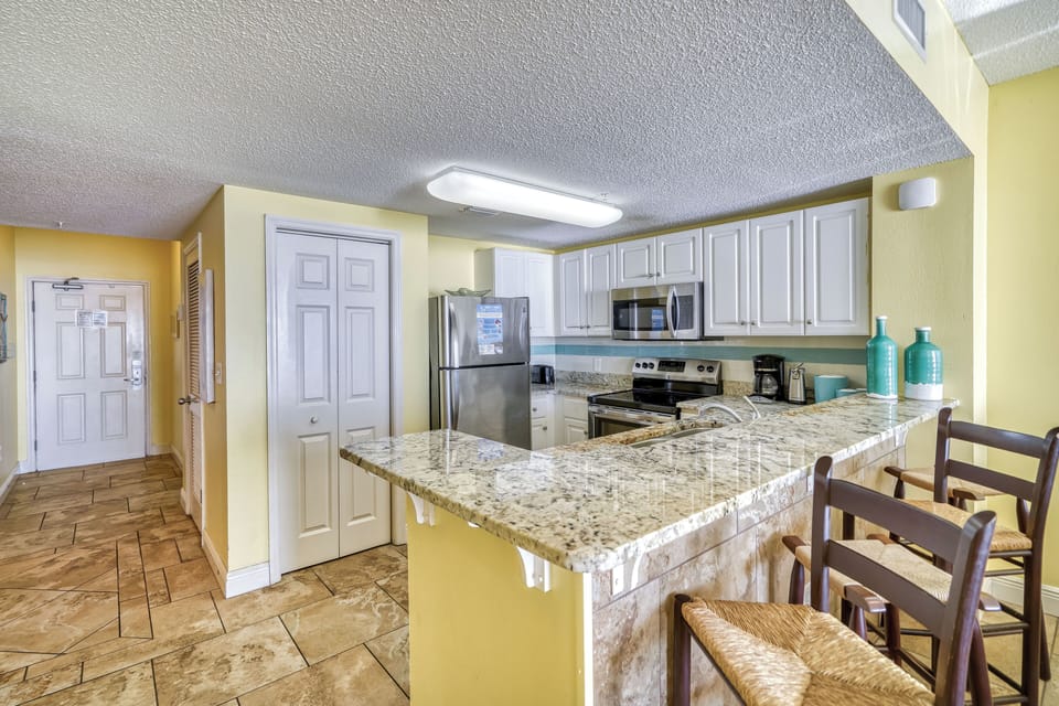 Sit up at the bar while watching dinner being made in your own kitchen!