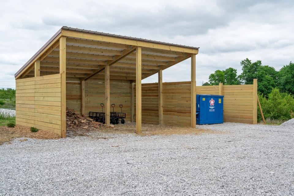 Trash dumpster for trash disposal. Free firewood in shed, borrow wagons to transport wood.