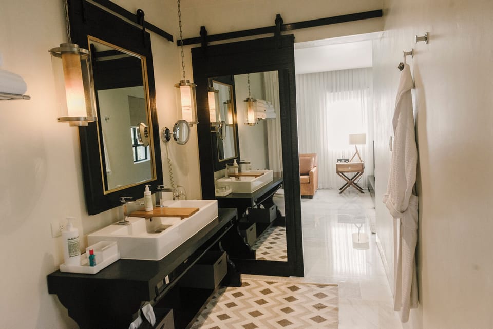 Junior Suite, 1 King Bed | Bathroom | Combined shower/tub, rainfall showerhead, designer toiletries