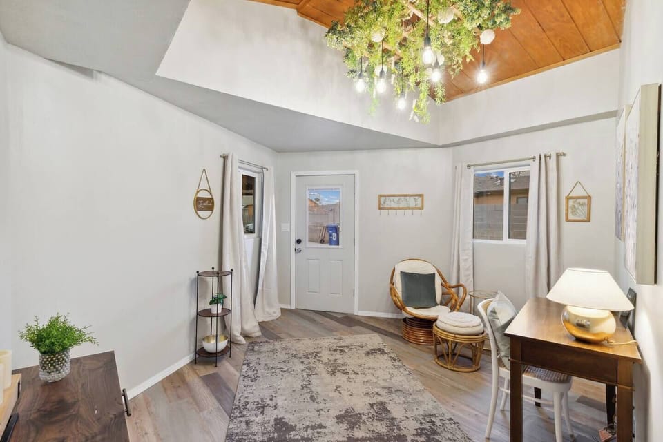 Entry space with extra space to relax and has a desk workspace