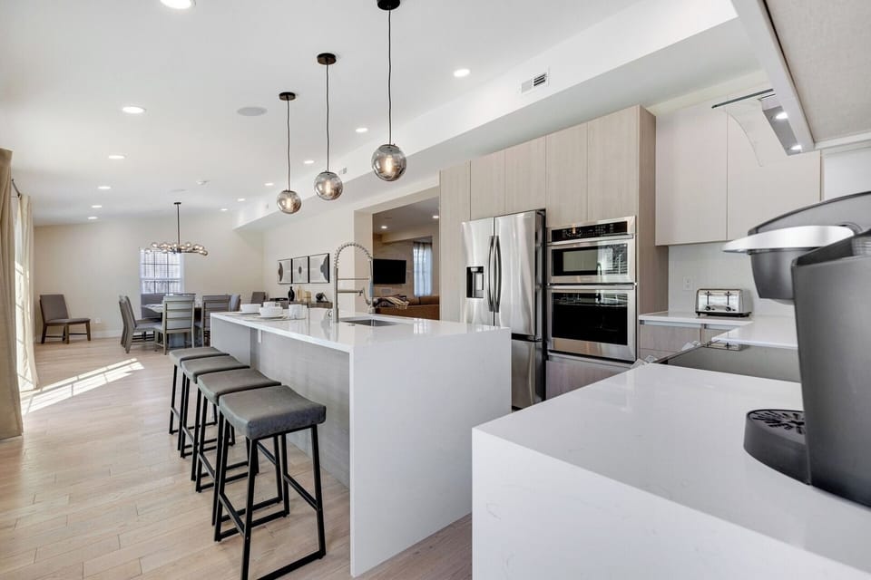 Your spacious kitchen includes an extended island and custom built cabinets. 