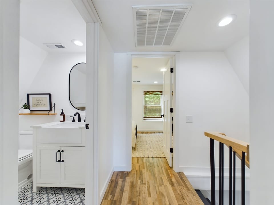 Between the 2 bedrooms is a full bath with shower.
