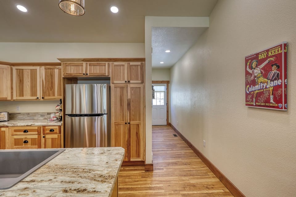 Hallway to half bathroom, laundry room, and backdoor.