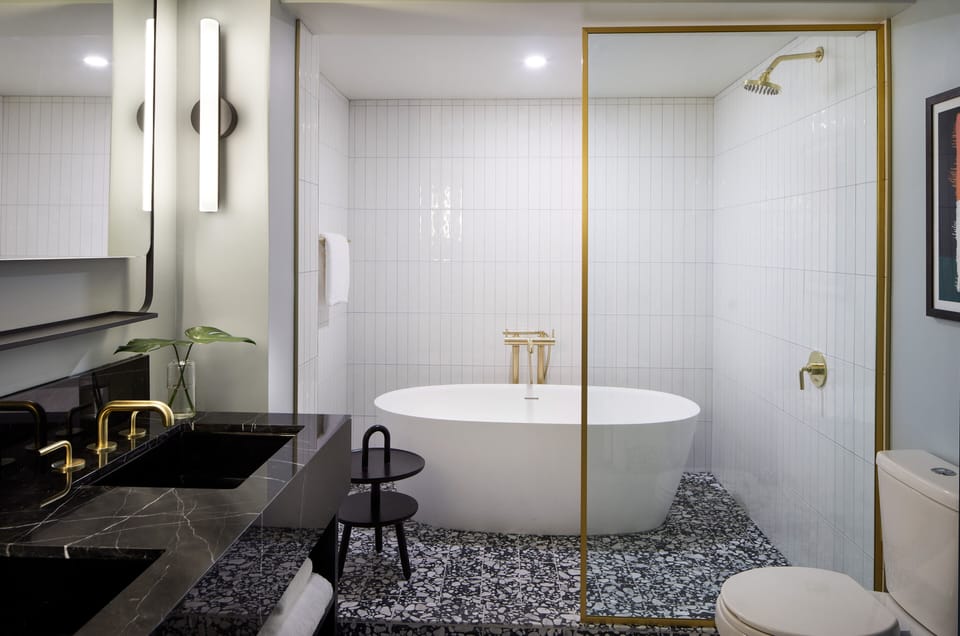 Suite, 1 Bedroom | Bathroom | Rainfall showerhead, designer toiletries, hair dryer, bathrobes