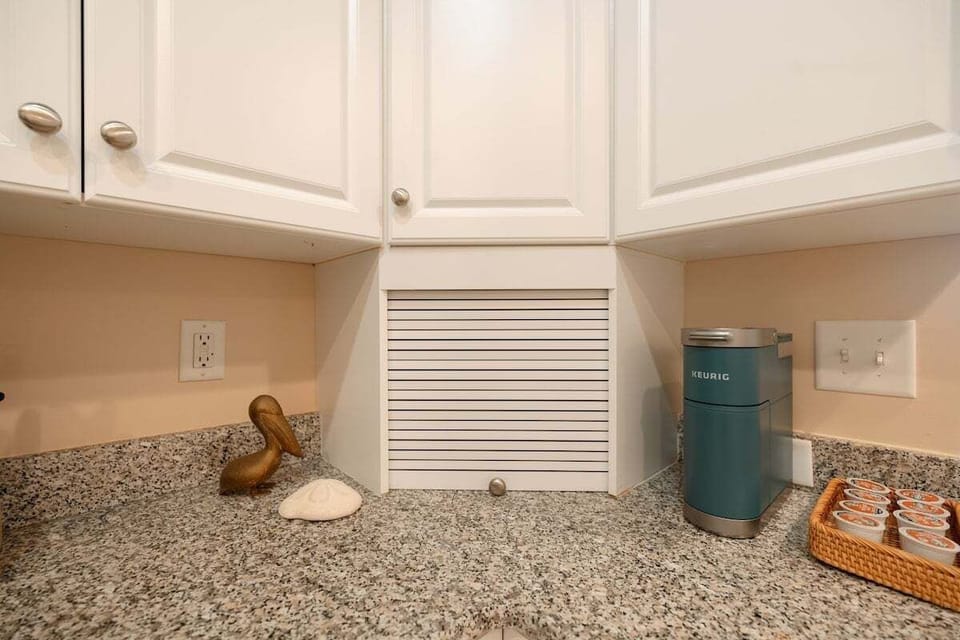 Modern kitchen fully stocked with cookware, appliances, Keurig and standard coffee makers, and everything needed for cooking and hosting during your stay