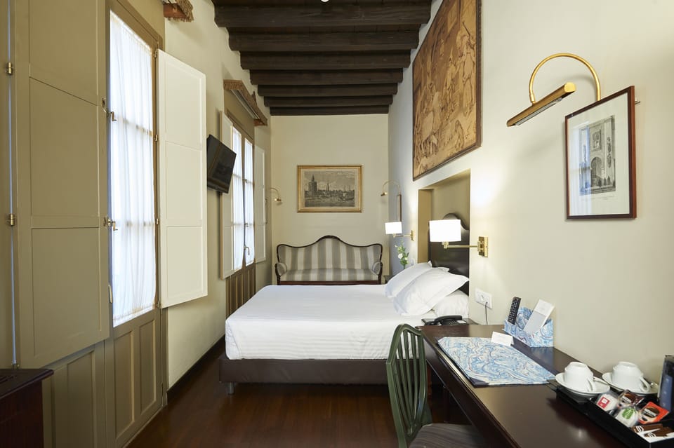 Classic Room | Minibar, in-room safe, individually furnished, desk