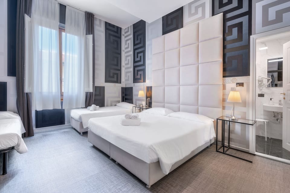 Quadruple Room | Down comforters, minibar, in-room safe, desk
