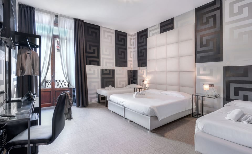 Quadruple Room | Down comforters, minibar, in-room safe, desk