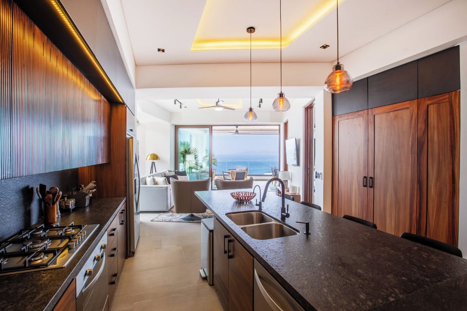 The kitchen amenities include a full-size fridge, stove, oven and dishwasher