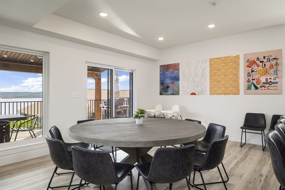 Main Level: Dining Room seating 12 at dining table, 4 at counter, and with 2 high chairs