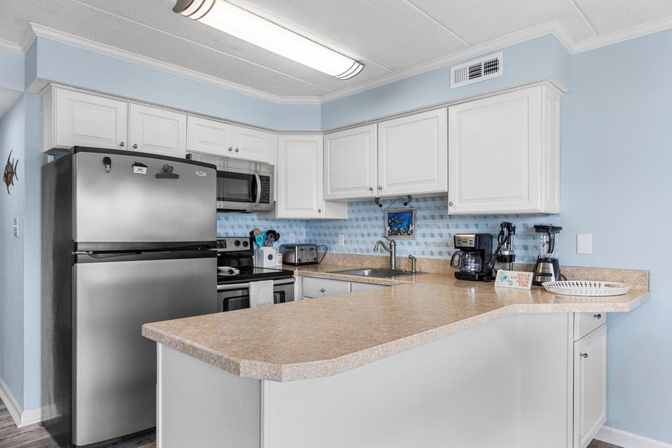 The kitchen overlooks the living and dining area
