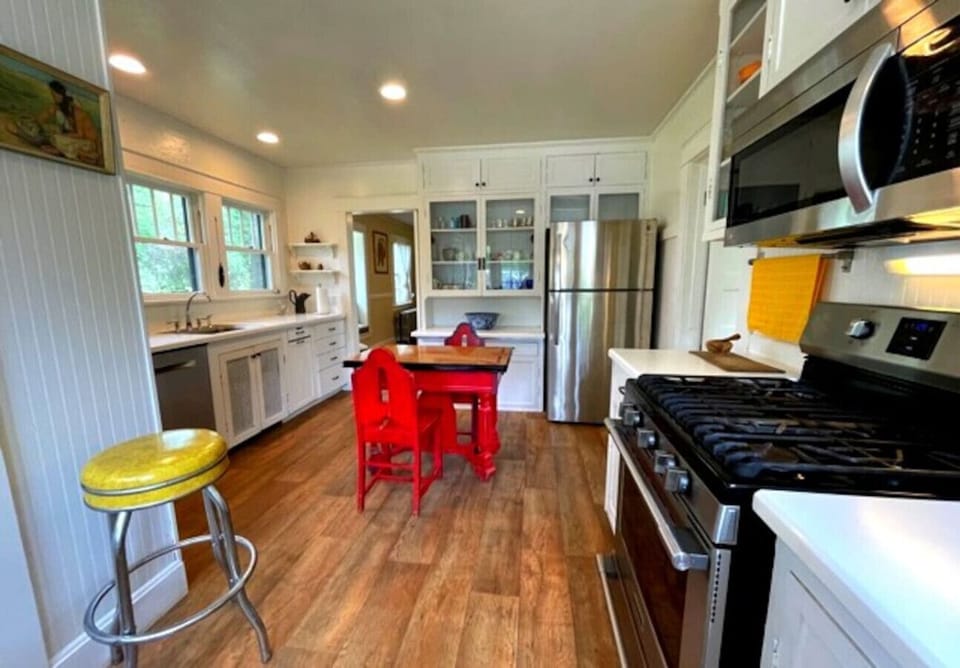 Large Kitchen filled with all the amenities including dishwasher, large fridge, gas stove and disposal. We have a vitamix and espresso machine. No detail omitted so you have everything you need to make healthy meals.