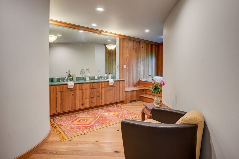 Master suite`s private bathroom that includes a beautiful tub with views, walk in shower and a separate room with a toilet and bidet