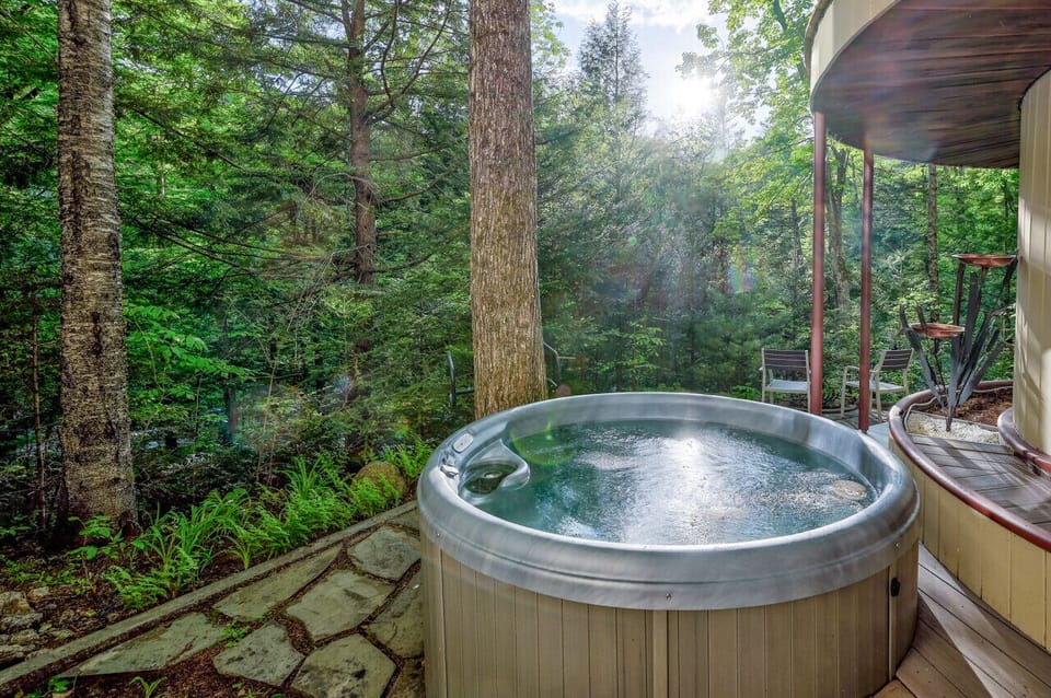 Listen to the sounds of the Ellis River while enjoying a southing hot tub