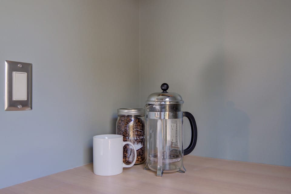 French press and locally roasted coffee beans