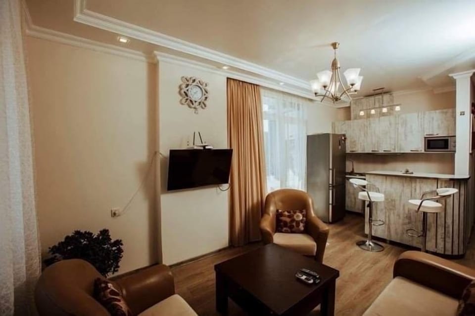 City Apartment | Living area | Flat-screen TV