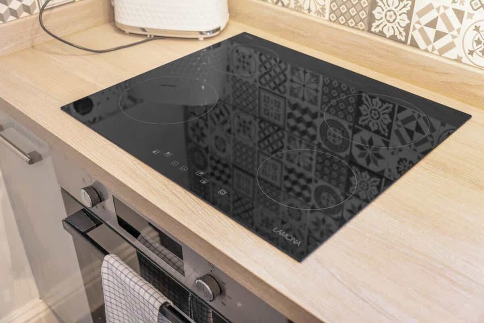 Designed with convenience in mind, the kitchen provides everything required for self-catering, including cookware, crockery, utensils, modern appliances, and a washing machine.