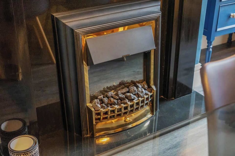 Whether you're sharing a family dinner or hosting friends, this dining space offers seating for six guests. A charming indoor fireplace adds a cozy touch to every occasion.