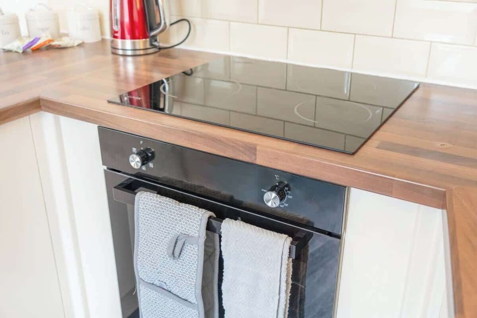Family-friendly kitchen oasis equipped with all essentials, including a washer & dryer, oven, fridge and full cookware set. Plus, thoughtful touches like children's dinnerware ensure everyone feels right at home in this cozy culinary haven.