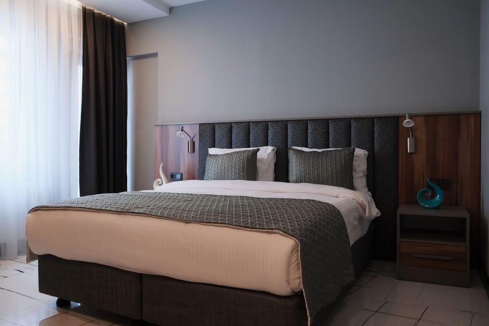 Family Suite, City View | 1 bedroom, desk, iron/ironing board, free WiFi