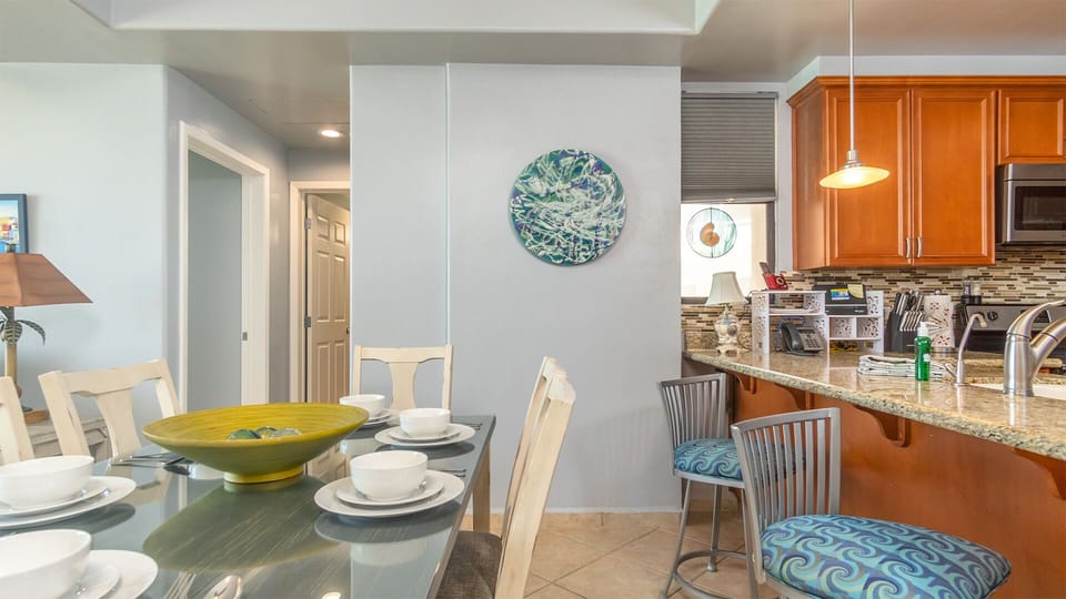the ding table sits next to the kitchen counter area