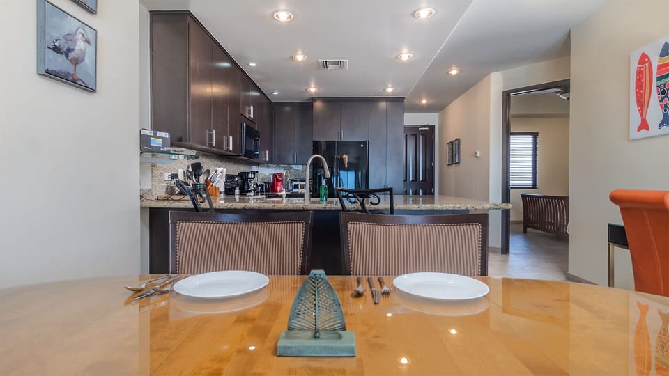 Dining table and kitchen counter.