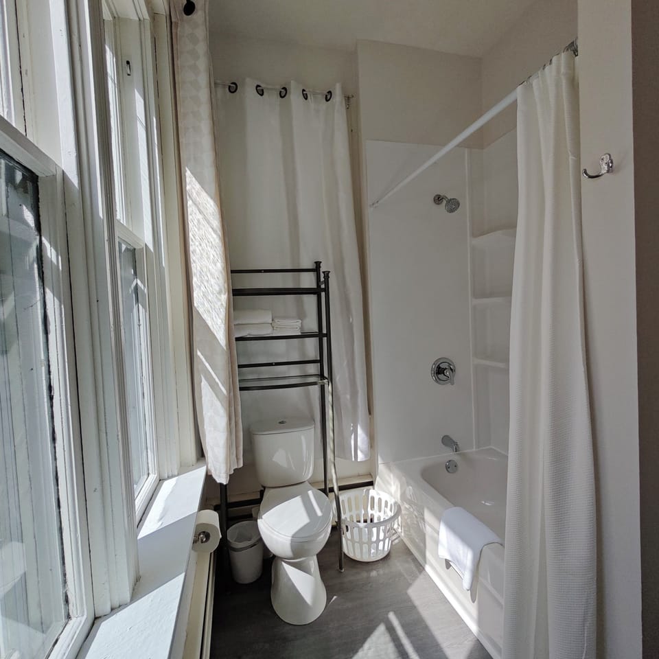 Classic Double Room, 1 King Bed, Ground Floor | Bathroom | Combined shower/tub, hair dryer, towels, soap