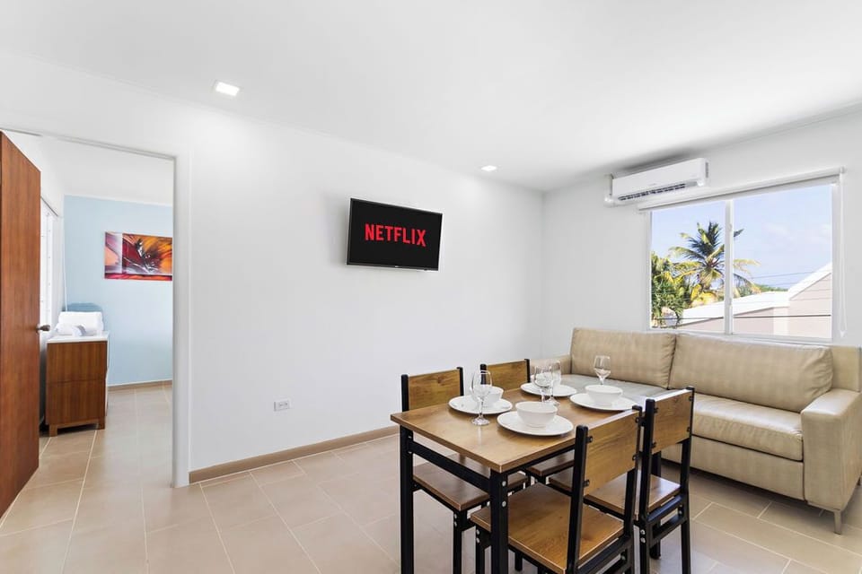 Our dining and living area is the perfect setting for cozy evenings and lively gatherings, with a comfortable sofa that beckons you to relax and enjoy the company of loved ones.