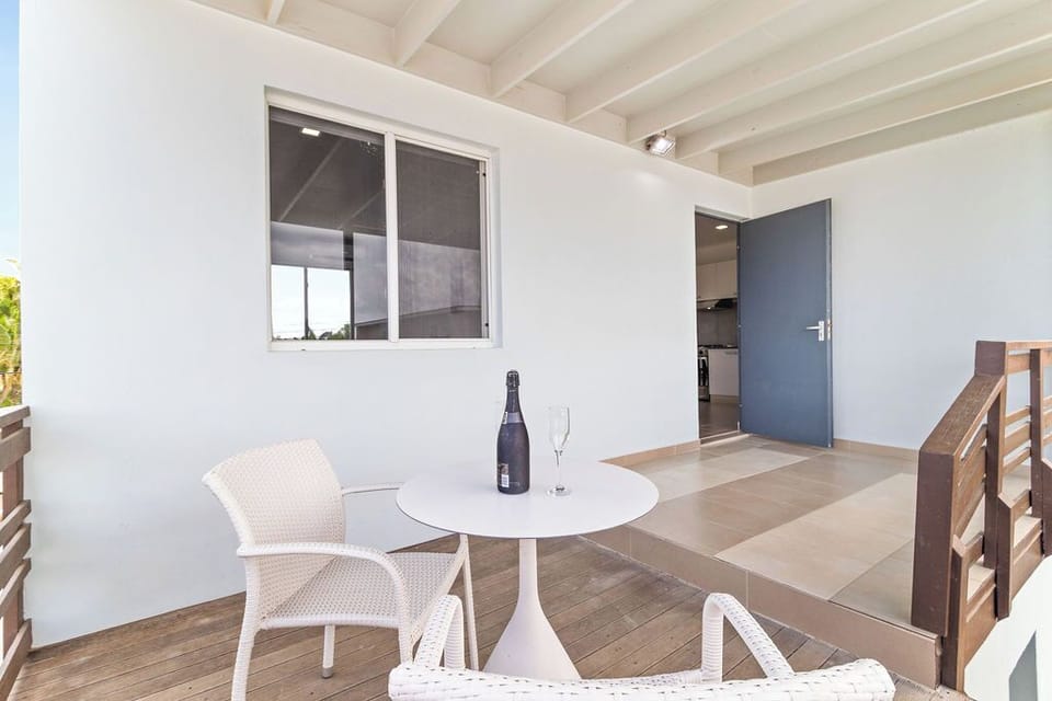 Our balcony offers a charming setting with comfortable seating and a coffee table, perfect for enjoying your morning coffee or evening cocktails while taking in the scenic surroundings.