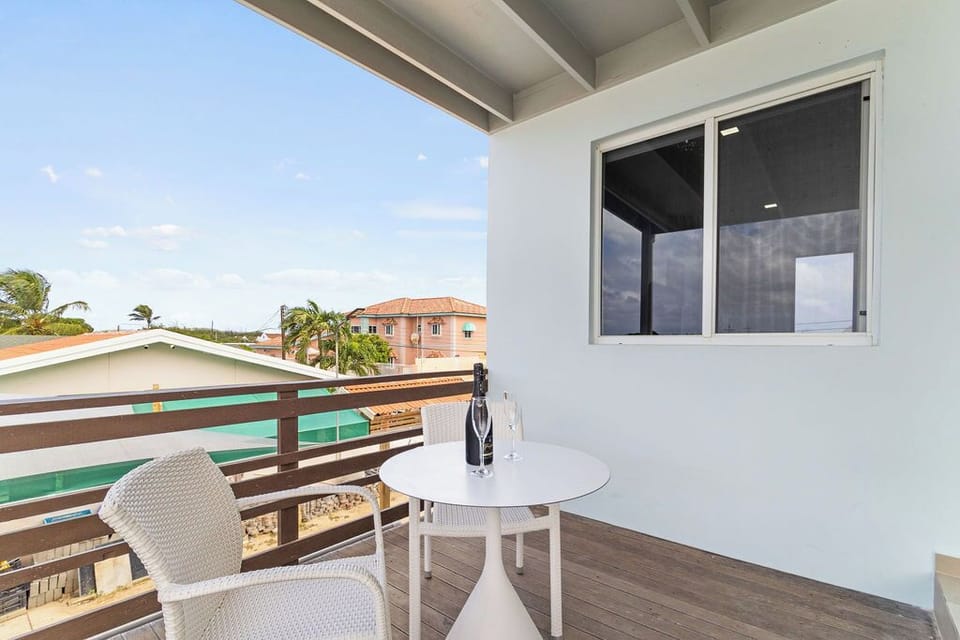 Step onto our balcony and unwind in style with cozy seating and a coffee table, providing the ideal spot to relax, soak up the sunshine, and enjoy the fresh air.