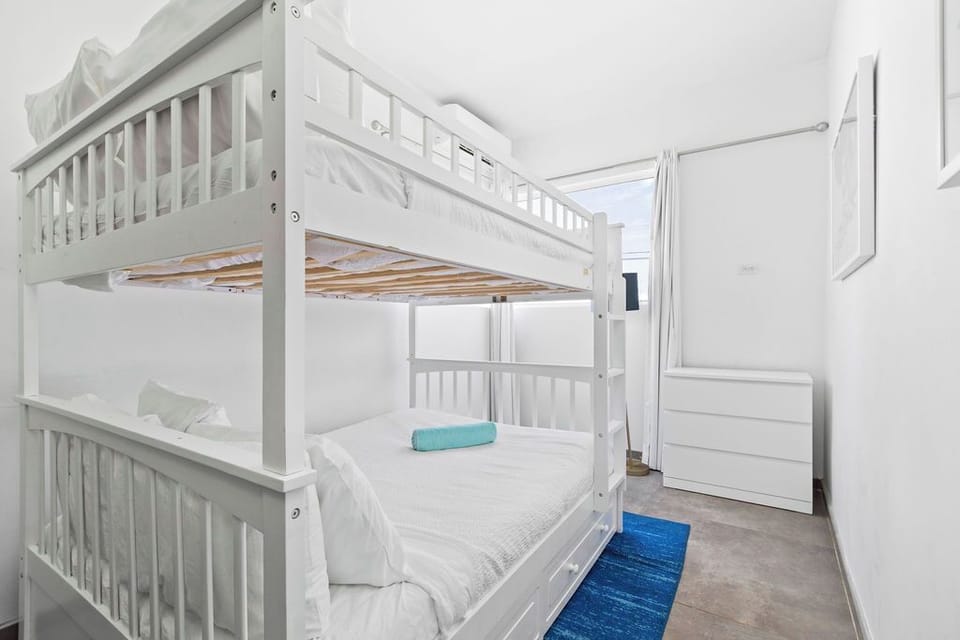 Sleep comfortably and playfully in our cozy bedroom featuring bunk beds.