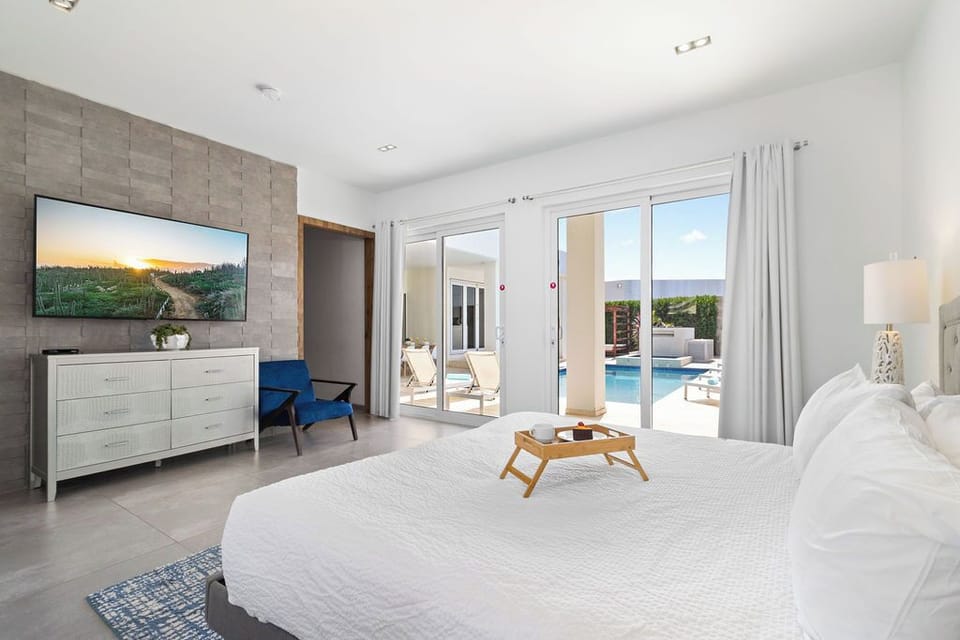 Relax with loved ones in our bedrooms, featuring premium TVs for your entertainment.
