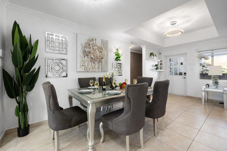 Embrace the seamless flow of our living and dining areas, where natural light dances through expansive windows, illuminating the stylish decor and inviting atmosphere.