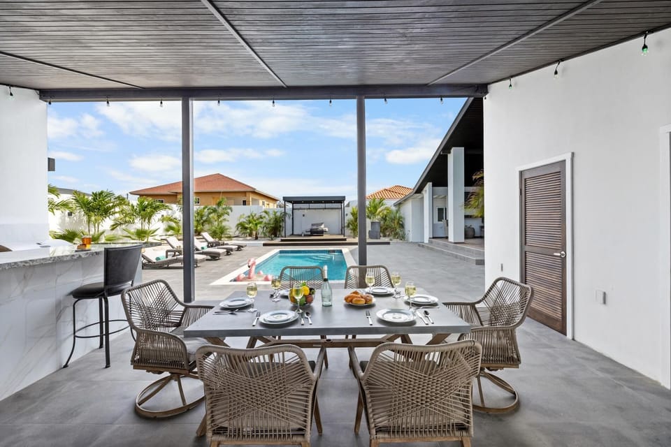 Step from indoors to out seamlessly, as our open space design beckons you to dine under the stars or bask in the sun's warmth amidst comfortable outdoor seating arrangements.