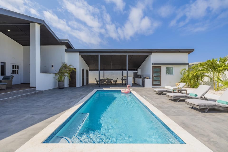 Dive into relaxation in our refreshing pool, surrounded by sun loungers and the inviting aroma of barbecue. Every moment here is a vacation dream come true.