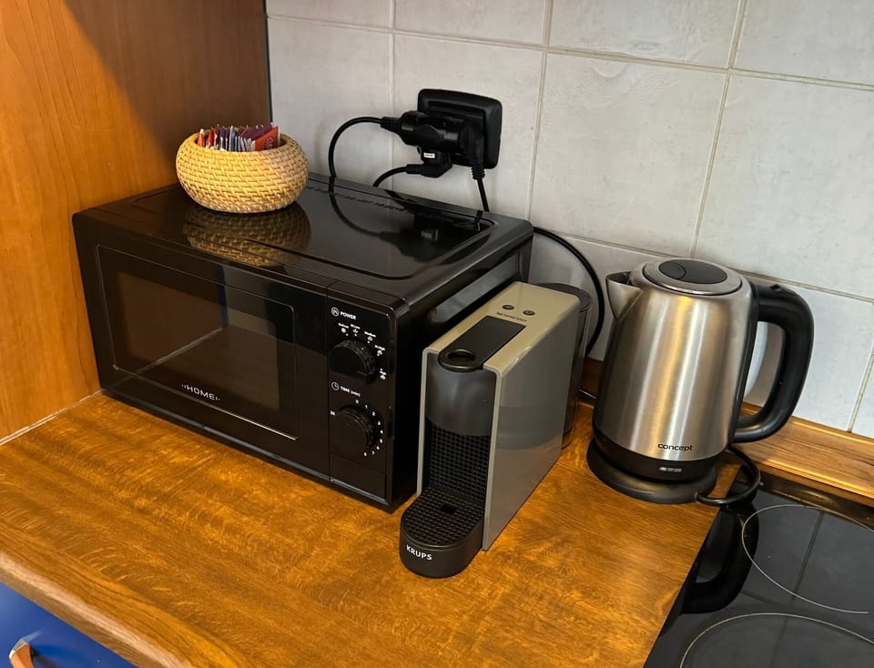 Microwave, kettle & Nespresso machine.