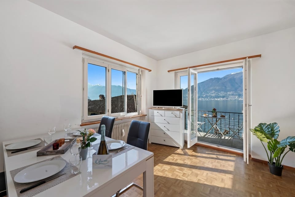 Family Apartment, 1 Bedroom, Balcony, Lakeside (Garden on the lake 1 -Vira Gambarogno) | Living area | Flat-screen TV