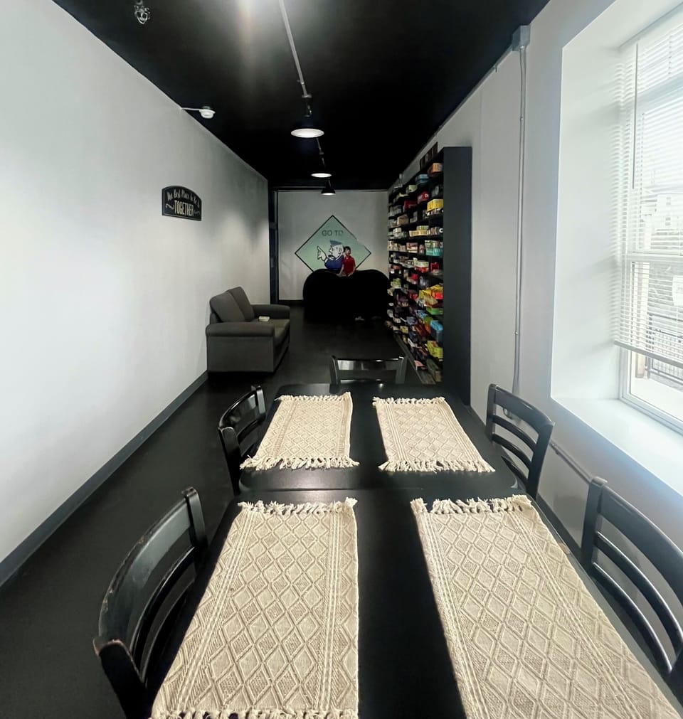 Dinning/ game area with an original Jail Cell
