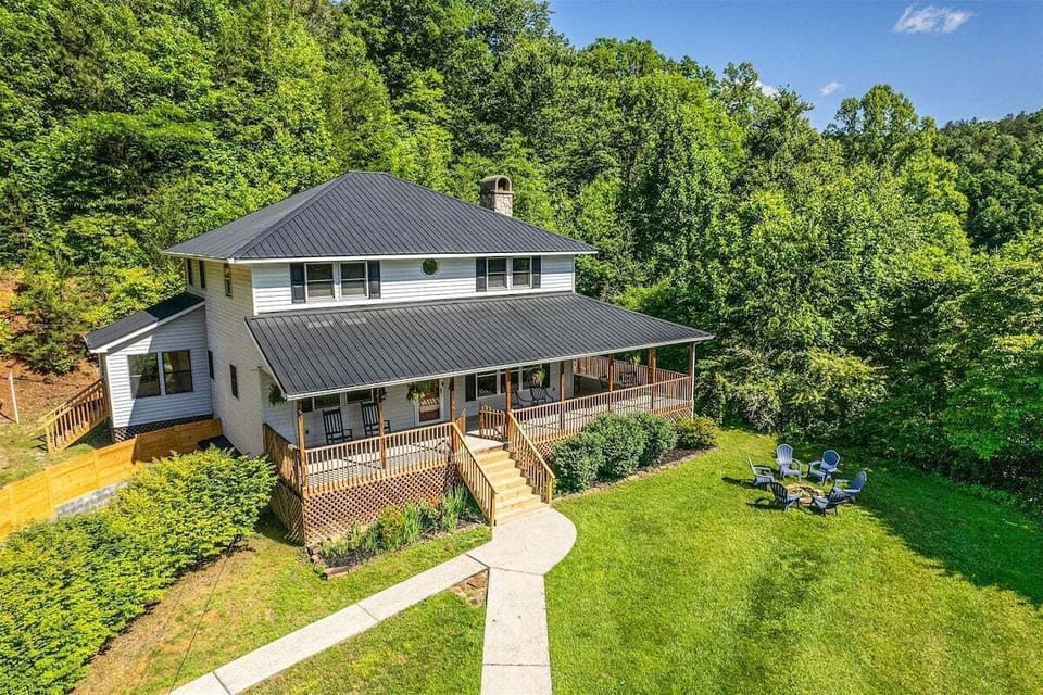 A relaxing open deck with forest and rolling hill views makes outdoor dining a delight.