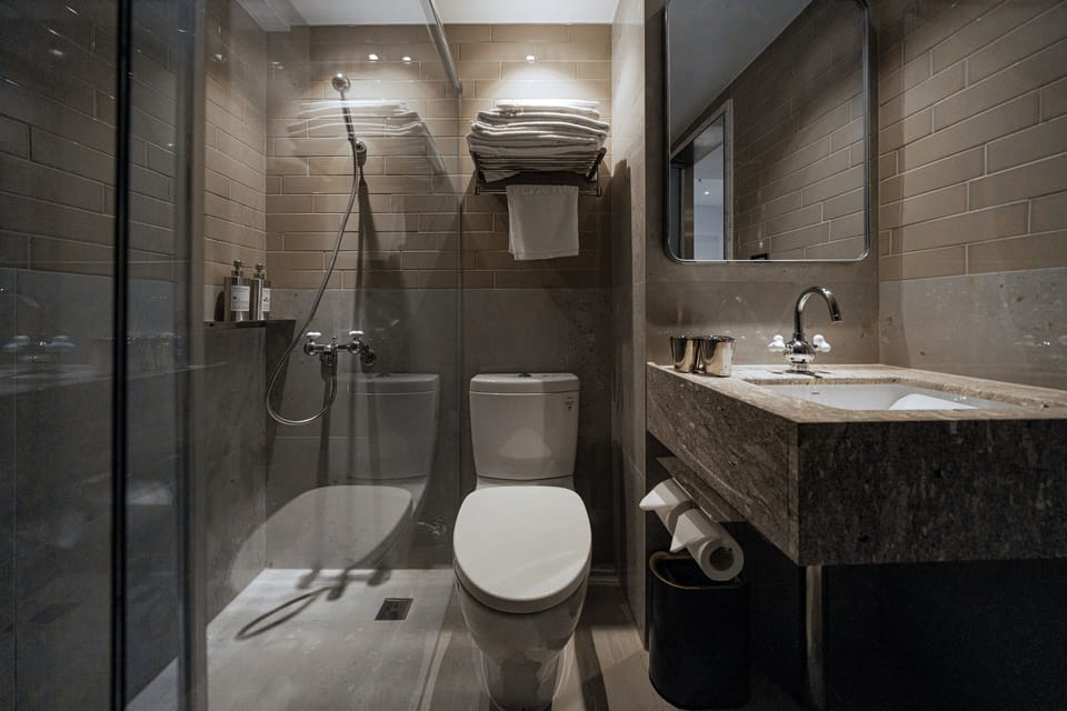 Classic Triple Room, City View | Bathroom | Shower, rainfall showerhead, hair dryer, slippers