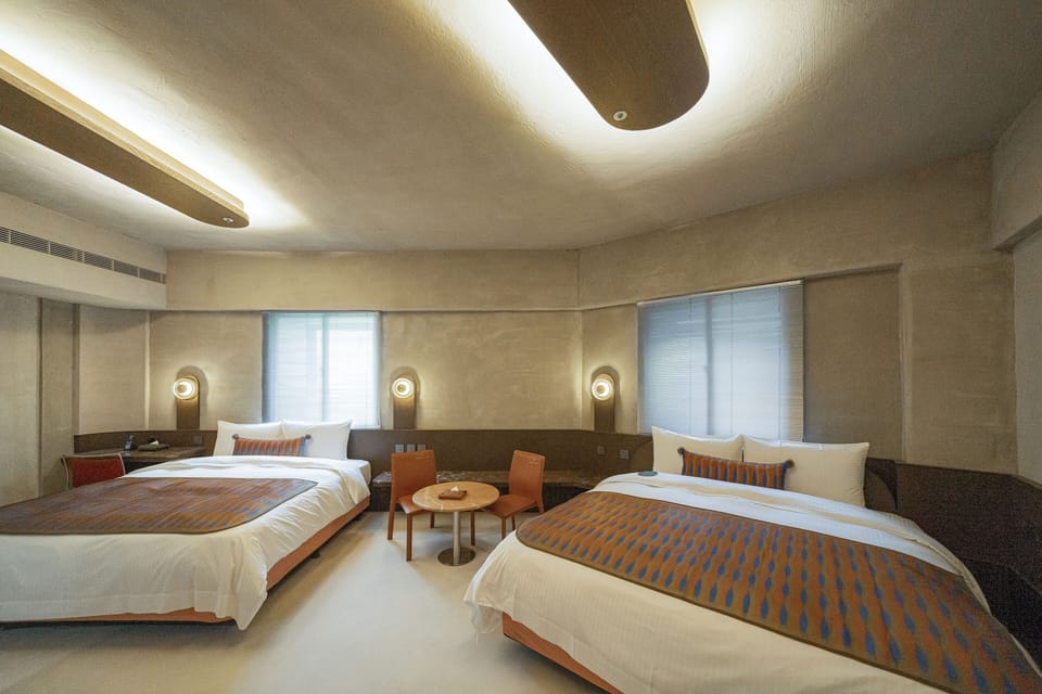 Deluxe Quadruple Room, City View | Down comforters, desk, blackout drapes, soundproofing