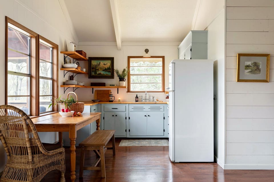 The living room is open to the fully-stocked kitchen and indoor dining area