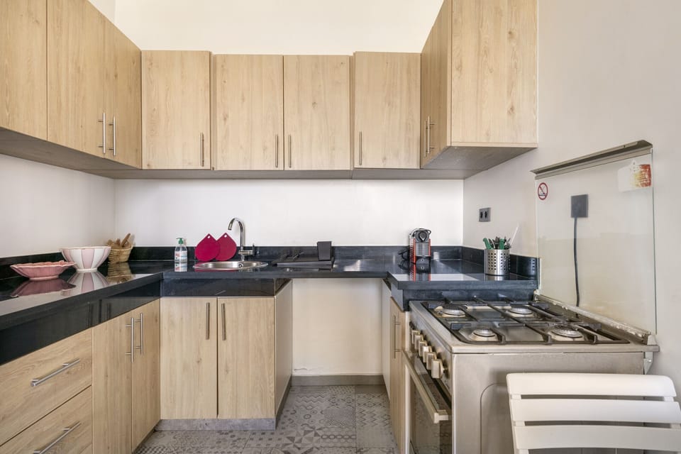 Modern Kitchen with white cabinets and stove