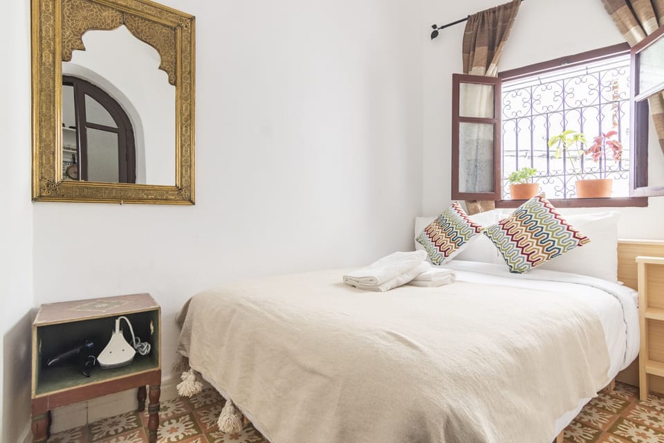 This inviting bedroom features a plush bed and a calming atmosphere, perfect for a restful night's sleep.